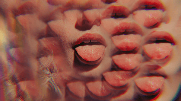 closeup of women's mouth and tongue