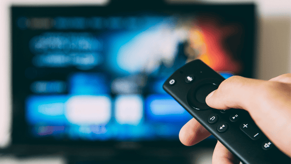 watching tv with a remote