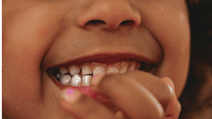 a young child with her teeth