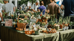 A photo of a busy food and flower festival
