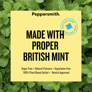 A square pale yellow label with black text reading 'Peppersmith. MADE WITH PROPER BRITISH MINT' over a background of green mint leaves.
