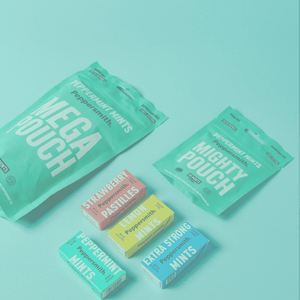 PHOTO OF Peppersmith's collection of MINT products. MEGA POUCH, MIGHTY POUCH, STRAWBERRY PASTILLES, LEMON MINTS, EXTRA STRONG MINTS AND PEPPERMINT MINTS ON A BLUE BACKGROUND