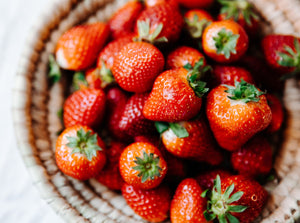 A large bowl of fresh strawberries 