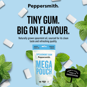 Peppersmith Spearmint Gum Mega Pouch package on a light blue background with scattered gum pieces and mint leaves. Large text reads 'TINY GUM.