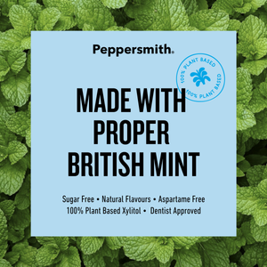 A square light blue label with black text reading 'Peppersmith. MADE WITH PROPER BRITISH MINT' over a background of green mint leaves.